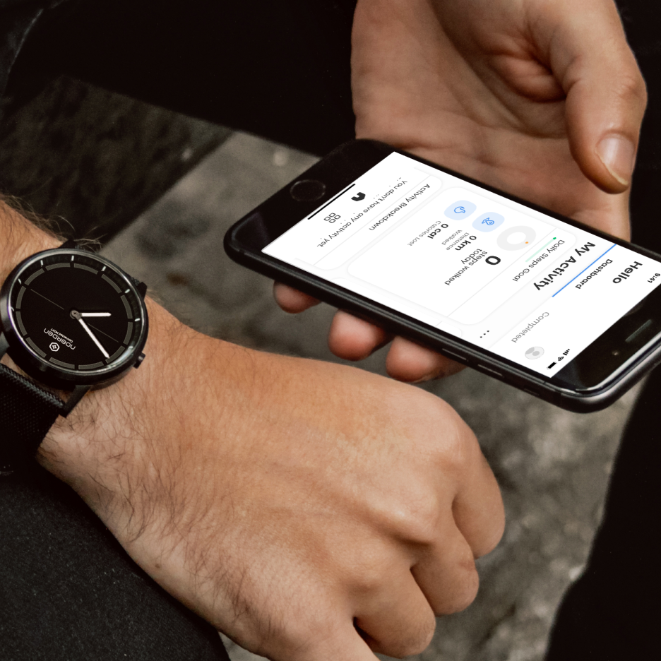 Male hands holding phone with NOERDEN activity page and wearing mate2+ black watch